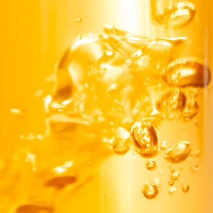 Close-up of a yellow liquid with bubbles