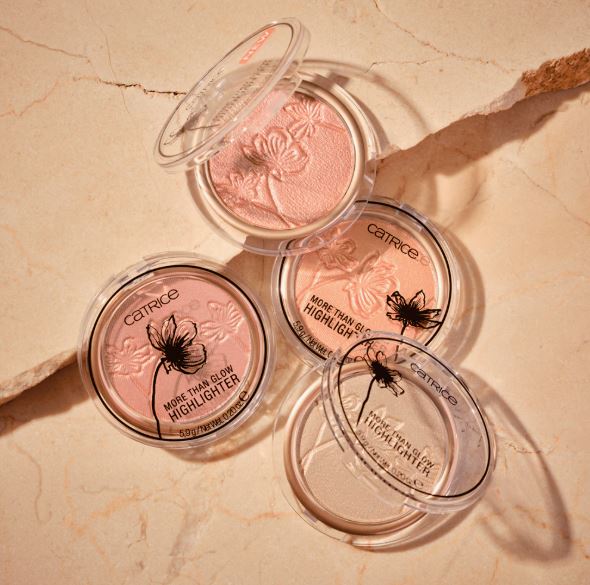 Catrice highlighters on a beige marble surface