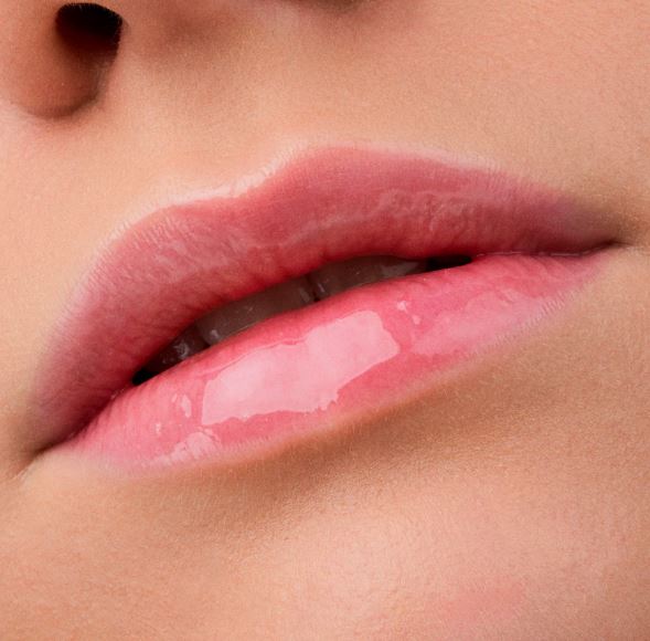 Close-up of a person's lips with a glossy lip product