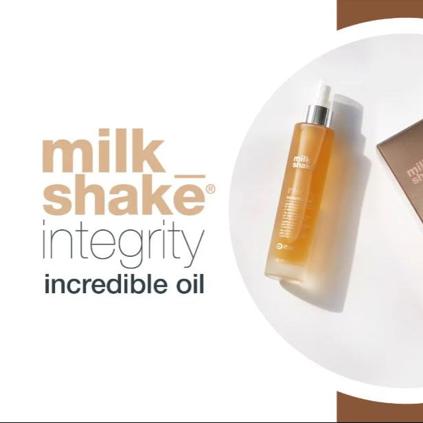 Milk Shake Integrity incredible oil bottle on a white surface with brand name displayed.