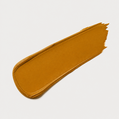 Mustard yellow paint swatch on a light gray background