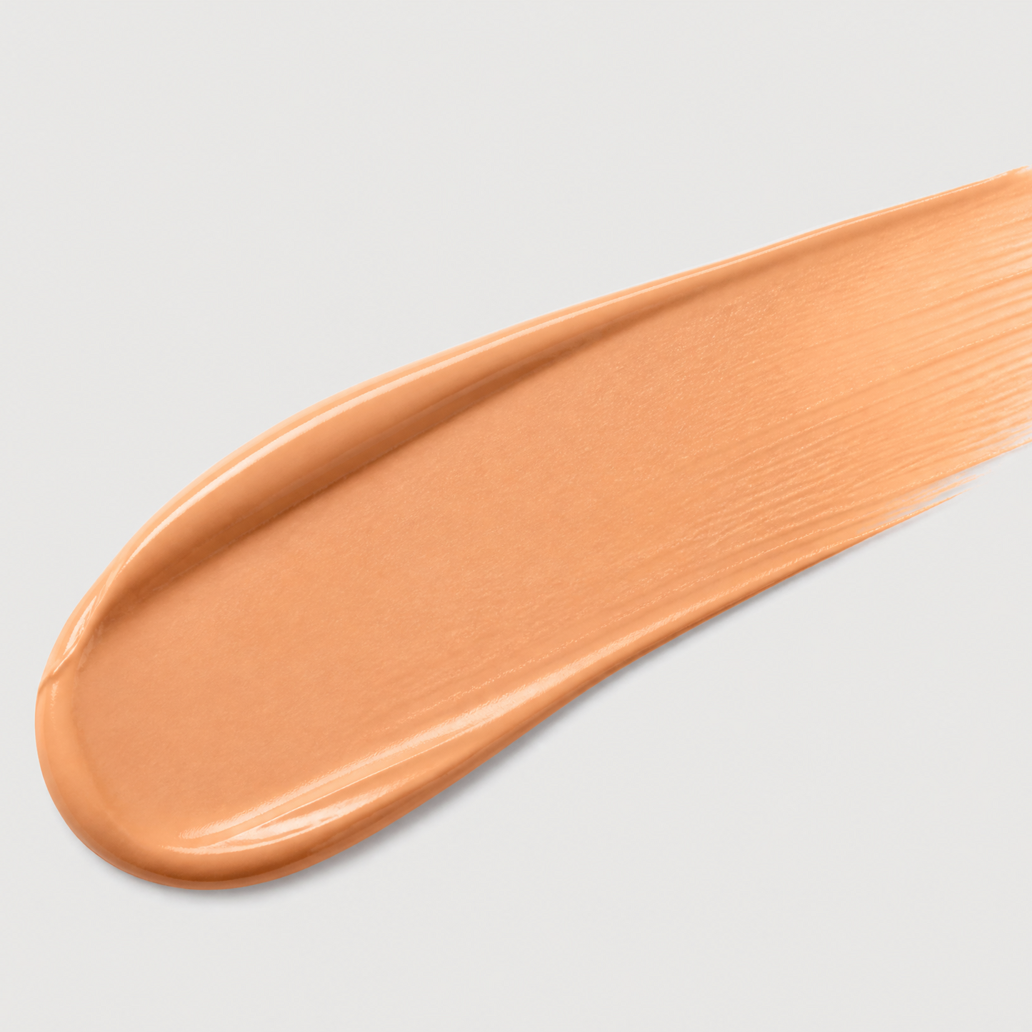 Beige makeup swatch on a light gray background