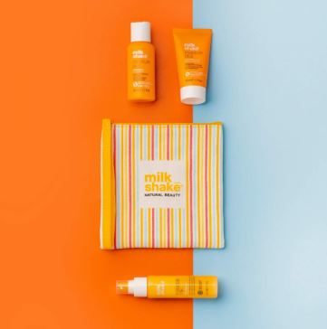 Milk Shake beauty products on a two-tone orange and blue background