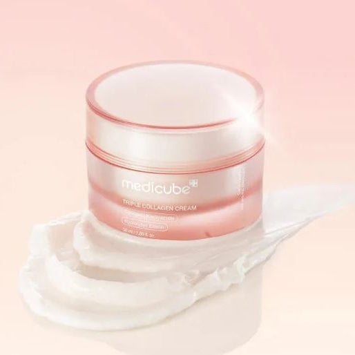 Medicube cream jar with pink lid on a light pink background