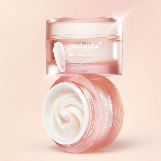 Medicube cream jar with open lid on a light pink background
