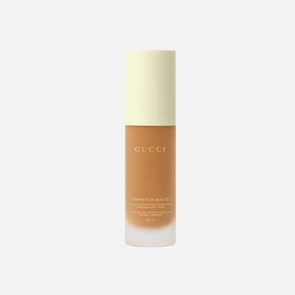 Gucci foundation bottle on a white background