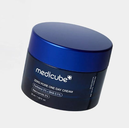 Medicube Zero Pore One Day Cream jar with blue lid on a light gray background
